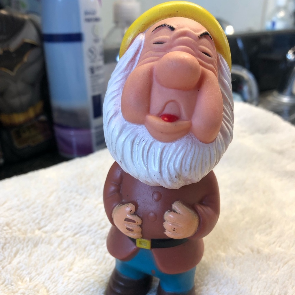 Vintage Walt Disney Productions squeaky vinyl figure of Sneezy off Snow White